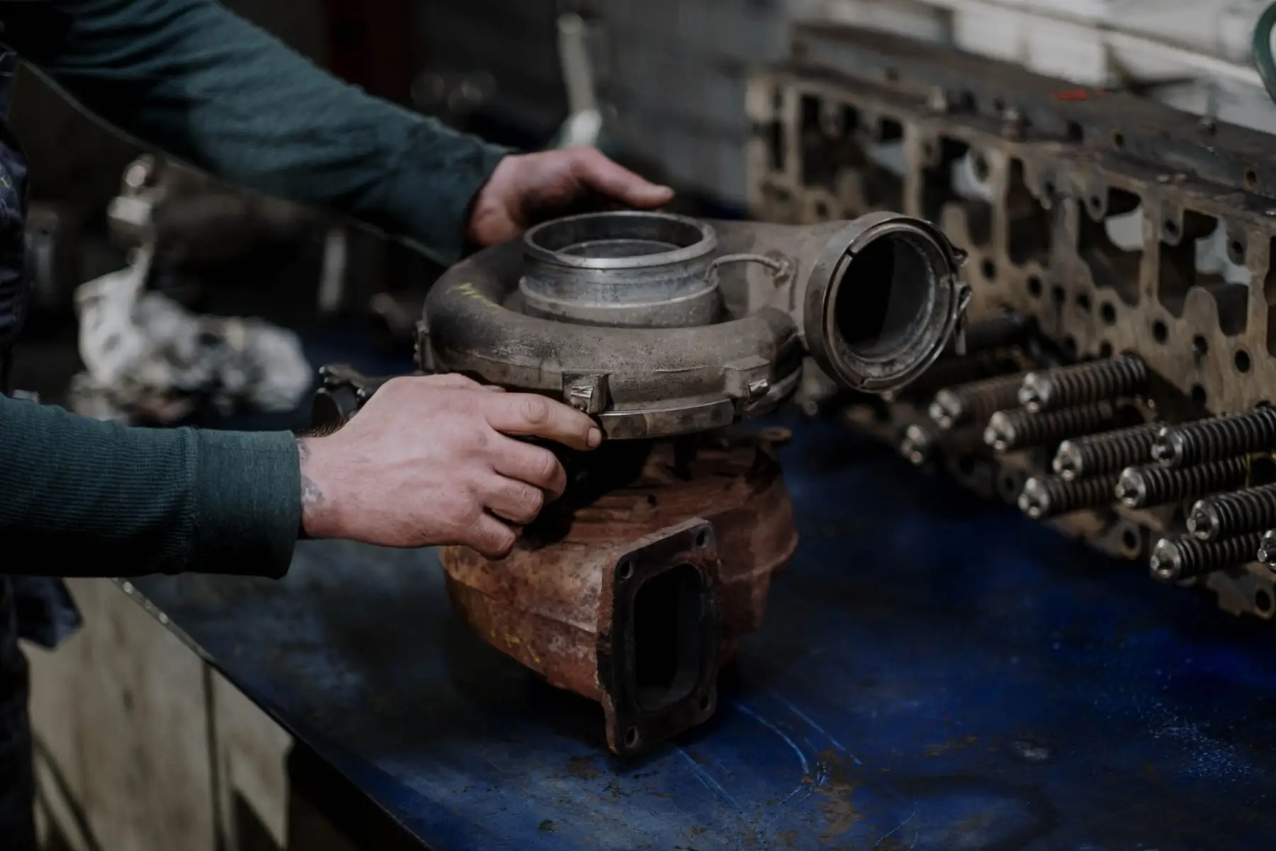 A diesel engine bay with the intake and turbo pipework visible
